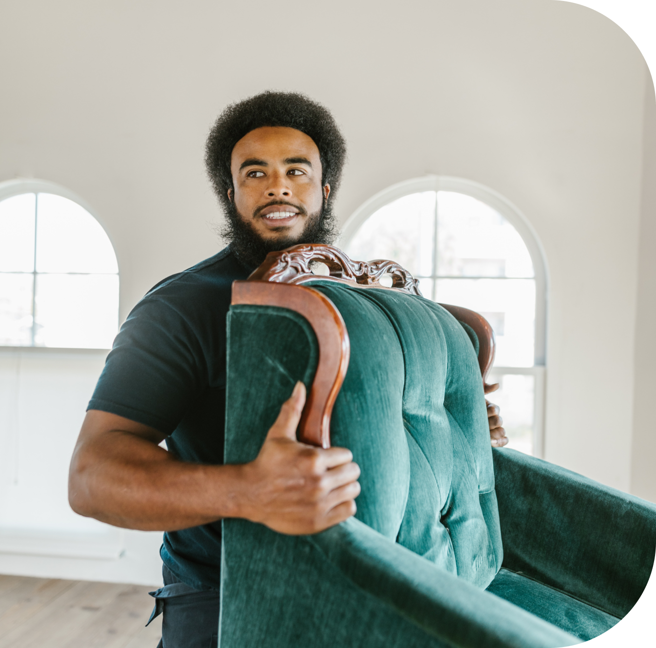 A man carrying a green chair